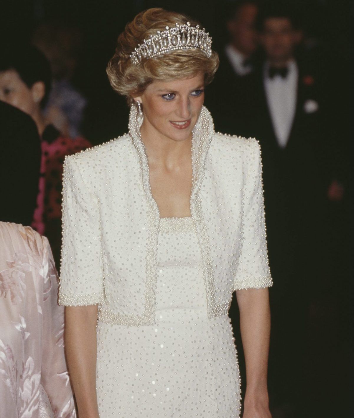 Diana, Princess of Wales (1961 - 1997) attends the gala opening of a cultural centre in Hong Kong, November 1989. She is wearing a white beaded evening gown by Catherine Walker and the Queen Mary tiara. 